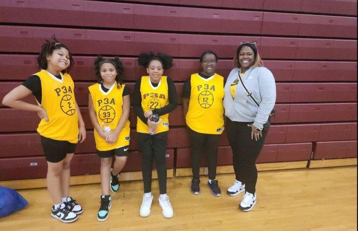 girls basketball team posing